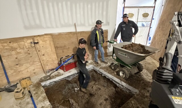 Testing the firmness of the sub-soil.